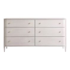 a white dresser with six drawers and two handles