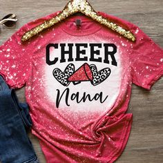 Cheer Nana Red Unisex Bleached Shirt Brand: Gildan Softstyle  Color: Heather Red Available Sizes: Small-4x Available  Ships USPS First Class with tracking Upon receipt of your order please leave a rating as it helps grow my small business and receive funding for the item purchased. Thank you! Fitted Short Sleeve T-shirt For Cheerleading, Red Crew Neck T-shirt With Name Print, Red Short Sleeve T-shirt With Name Print, Red Cotton Tops With Name Print, Red Cotton Top With Name Print, Red Crew Neck Top With Sublimation Print, Red Fitted Tops For Cheerleading, Fitted Red Tops For Cheerleading, Red Short Sleeve Top For Cheerleading