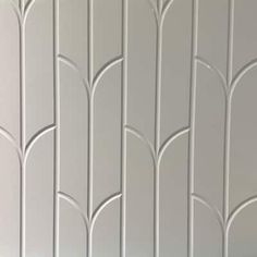 a white wall with decorative lines on it