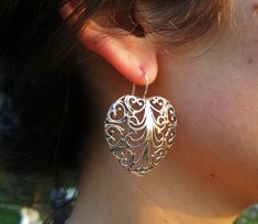 Sterling Silver Filigree Earrings, Heart Shape with a gentle Lace design. This pair of earrings is gentle as lace and outstanding as our hearts. WIll make the perfect gift for your beloved ones and thy self. Comes in a gift jewel box - ready to give away! Length: 4.2 cm (from the top of the wire) Max Width: 3.3 cm. Please let me know if you have any questions. our jewelry shop on Etsy: http://www.etsy.com/shop/Porans Thanks for visiting! Please visit my shop policies for additional information Elegant Pierced Heart Earrings, Elegant Silver Heart Earrings For Pierced Ears, Heart Shaped Filigree Jewelry, Heart-shaped Filigree Jewelry, Elegant Sterling Silver Open Heart Earrings, Elegant Silver Heart Earrings, Elegant Heart-shaped Hypoallergenic Earrings, Elegant Hypoallergenic Heart Pendant Earrings, Elegant Silver Pierced Heart Earrings