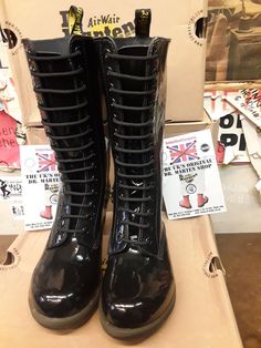 These are a now deleted model of Dr Martens boots. These 14 hole boots are finished in black Patent leather and have a heel that you'll find very comfortable too wear on a daily basis. They have a cushioned sole and footbed. They also have a side zip for ease of use. These are a UK size 5, European 38, ladies USA 7 Alternative Style Black Boots With Round Toe, Black Round Toe Alternative Boots, Fitted Knee-high Black Combat Boots, Black Fitted Knee-high Combat Boots, Fitted Black Knee-high Combat Boots, Alternative Style Fitted Boots With Round Toe, Alternative Black High Ankle Lace-up Boots, Black Knee-high Lace-up Boots Alternative Style, Alternative Style Black High Ankle Lace-up Boots