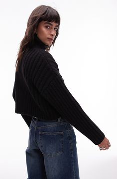 A chunky rib adds extra cozy points to a wool-kissed sweater knit to a cute, cropped length. 22" length (size Medium) Turtleneck Long sleeves 95% polyester, 5% wool Machine wash, line dry Imported Black Cropped Sweater With Ribbed Collar, Winter Knit Cropped Sweater With Ribbed Collar, Cozy Ribbed Cropped Sweater In Relaxed Fit, Ribbed Cropped Sweater In Relaxed Fit For Fall, Ribbed Relaxed Fit Cropped Sweater For Fall, Winter Cropped Cable Knit Sweater, Cropped Cable Knit Winter Sweater, Casual Black Cropped Sweater With Ribbed Collar, Black Cropped Sweater With Ribbed Collar For Fall