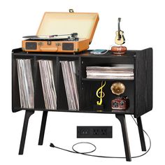 an old record player is sitting on top of a cabinet with records and vinyls