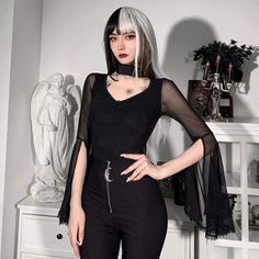 When Darkness Comes Top. This sheer mesh top has flared bell sleeves and a collar neckline with a back closure and a front cutout. Product Details Black Polyester, Spandex Size Guide Size Chest Waist Sleeve Length S 77 64 70 M 81 69 71 L 85 73 72 Unit: cm NOTE: 1. Please strictly follow the size chart to select the size. Do not select directly according to your habits. 2. The size may have 2-3cm differs due to manual measurement. Please note when you measure How to Measure To choose the correct Black Sheer Mesh Top Gothic Style, Fitted Gothic Mesh Top, Gothic Mesh Top With Mesh Sleeves For Night Out, Gothic Mesh Top With Mesh Sleeves, Black Tops For Spring Cosplay, Black Top For Spring Cosplay, Spring Black Top For Cosplay, Gothic Fitted Top With Sheer Sleeves, Spring Gothic Mesh Top