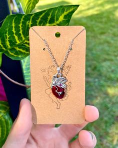 This deep red heart pendant steals the show suspended from the it's shiny silver chain ❤️🔒 * Lifelike anatomical silver heart pendant * Veins, arteries, chambers * Handmade by a local NJ artist Red Heart-shaped Sterling Silver Charm Necklace, Anatomical Heart Pendant, Anatomical Heart Necklace, Red Heart Pendant, Anatomical Heart, Silver Heart Pendant, Shiny Silver, Charm Necklaces, Silver Heart