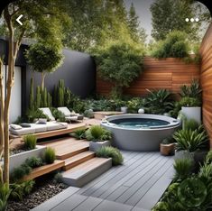 an outdoor hot tub surrounded by plants and trees