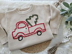 Baby/toddler/small kids Christmas Sweater. All are handmade to order and could take up to 3 weeks to ship. Personalizalions are an option upon request. **small pieces on item can be hazardous**  ** Keep an eye on children at all times** Kids Ornament Sweater, Kids Christmas Sweater, Toddler Christmas Sweater, White Christmas Baby Sweater, Embroidery Sweater Diy, Toddler Christmas Sweatshirt, Kids Christmas Sweaters, Christmas Tree Sweater, Tree Sweater