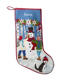 an embroidered christmas stocking with a snowman and dog