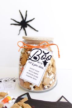 a glass jar filled with halloween treats