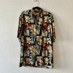 Black & multi-color short sleeve collared Hawaiian print button up shirt with a front breast pocket. Unlined. In excellent vintage condition. DETAILSLabel: Pierre CardinMade in Korea Material: 100% Rayon SIZE & MEASUREMENTSTag Size: Medium Length: 31"Bust: 46"Waist: 44"Sleeve: 10.5"Shoulder: 21.5"Includes Free US Shipping Patterned Short Sleeve Hawaiian Shirt With Graphic Print, Patterned Graphic Print Short Sleeve Hawaiian Shirt, Patterned Graphic Print Button-up Camp Shirt, Patterned Graphic Print Hawaiian Shirt, Printed Multicolor Collared Short Sleeve Shirt, Multicolor Printed Collared Camp Shirt, Multicolor Floral Print Short Sleeve Camp Shirt, Multicolor Hawaiian Shirt With Button Closure, Short Sleeve Shirt With Retro Multicolor Print