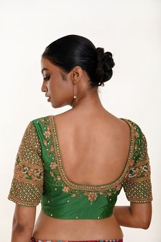 Elevate your style with this Forest Green Bridal Blouse crafted in Pure Silk featuring exquisite Zardozi Work. Perfect for pairing effortlessly with a saree or lehenga. Traditional Embroidered Wedding Blouse, Elegant Gold Blouse With Intricate Embroidery, Traditional Embroidered Top With Traditional Drape For Wedding, Traditional Embroidered Top With Drape For Wedding, Elegant Designer Blouse Piece With Intricate Embroidery, Elegant Designer Wear Blouse Piece With Intricate Embroidery, Traditional Embroidered Saree Top For Wedding, Traditional Embroidered Top With Festive Motifs, Designer Elegant Embroidered Top For Diwali