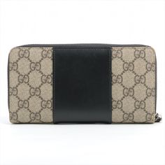 The Gucci GG Supreme Monogram Zip Around Wallet Beige and Black is a true embodiment of luxury and sophistication. Its design is a testament to Gucci's legacy of creating timeless accessories. The wallet features Gucci's iconic GG Supreme monogram canvas in a warm beige hue, adorned with the distinctive interlocking G pattern. The canvas is beautifully contrasted with black leather accents, creating a striking visual contrast that exudes elegance. The practical zip-around closure ensures the security of your essentials while adding a contemporary touch to the wallet's aesthetics. It proudly displays the classic Gucci embossed, showcasing the brand's rich heritage. Inside, the wallet is a model of organization. It offers an abundance of space for your daily essentials, including multiple ca Black Color Combination, Warm Beige, Beige And Black, Luxury Wallet, Loyalty Card, Gucci Leather, Designer Wallets, Leather Accents, Gucci Wallet