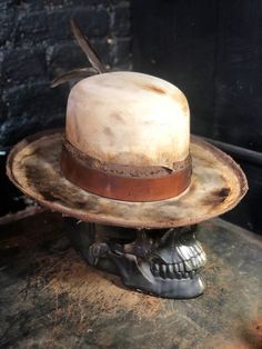 "All our hats are made to order ,we only use beaver Fur felts and we offer blends or 100%. The accessories as well as the bands that N.T.T.E uses for each individual customization are the result of a research of rare vintage pieces. N.T.T.E is a Fashion brand inspired from bohemian /rock n roll vibes . Each hat is a unique piece created from the research of vintage accessories and original designs, tailored specifically for each customer. Please before to order make sure to select your size and Handmade Vintage High Crown Top Hat, Custom Fur Felt Fedora With Flat Crown, Custom Kentucky Derby Costume Hat With Flat Brim, Vintage Fur Felt Hat With Flat Crown, Adjustable Top Hat With Short Brim For Derby, Adjustable Brimmed Hat For Derby, Adjustable Curved Brim Hat For Derby, Custom Festival Hat With Flat Crown, Custom Fur Felt Brimmed Hat Bands