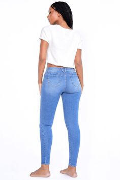 The 2000's called and low-rise jeans are back! Our Women's WannaBettaButt Low-Rise 1-Button Skinny Jean is the new hottest style of the year. Featuring our famous WBB heart shaped stitching, enhancing your natural curves. Constructed with stretchy denim fabric made from recycled fibers - you'll not only look amazing, but you'll feel amazing too! Pair these with a crop top for an extra flirty look! Product Details - Low-Rise - 1-Button Closure with Zipper - 5 Pocket Construction Size & Fit (based Spring Y2k Stretch Jeans, Y2k Stretch Jeans For Spring, Y2k High Rise Fitted Bottoms, Fitted High Rise Y2k Bottoms, Y2k High Rise Stretch Flare Jeans, High-rise Stretch Flare Jeans Y2k Style, High Rise Stretch Flare Jeans Y2k Style, Trendy Stretch Mid-rise Cropped Jeans, Y2k High-waisted Fitted Jeans