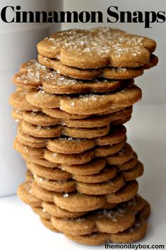 a stack of cookies sitting on top of each other with the words cinnamon snaps above it