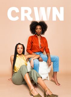 two women sitting next to each other in front of a sign that says crwn