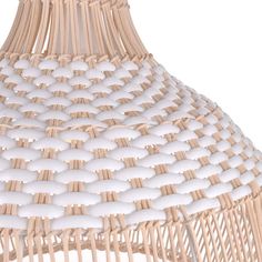 a white and brown hanging light fixture made out of wicker