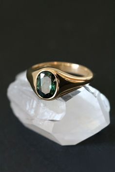 Exude timeless elegance with this unique signet ring. A vibrant 1.95ct Australian sapphire, boasting a deep forest green hue, is showcased in a gleaming 18ct yellow gold setting. Perfect as a statement piece or an alternative engagement ring, its warm tones and luxurious details make it a cherished heirloom. Currently an Australian size M, this one-of-a-kind ring can be resized. Gold Bezel Engagement Ring, Signet Engagement Rings, Sapphire Signet Ring, Mens Gold Signet Rings, Stone Ring Design, Couple Ring Design, Australian Sapphire, Custom Made Engagement Rings, Deep Forest Green