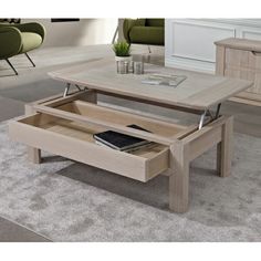 a coffee table with an open drawer underneath it in the middle of a living room