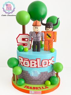 a cake decorated with lego figures on top of it