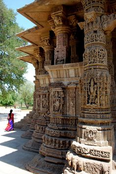 an intricately carved structure in the middle of a park