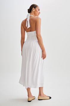 Summer ready.Introducing the HARRIETTE Halter Midi Dress, a captivating ensemble that exudes timeless elegance. With its V neckline and functional halter, this dress offers a chic and sophisticated silhouette. The fitted waist accentuates your figure with grace, while the gathered skirt adds a touch of femininity and movement. Designed in a midi length, it strikes the perfect balance between sophistication and allure. Lined for comfort and coverage, the Harriette is perfect for any occasion wher White Tie-back Midi Dress For Formal Occasions, Fitted Halter Neck Lined Maxi Dress, Formal Sleeveless Midi Dress With Gathered Neckline, Halter Neck Cocktail Dress With Fitted Bodice, Cocktail Dress With Fitted Bodice And Halter Neck, Cocktail Halter Neck Dress With Fitted Bodice, Fitted Midi Dress With Lined Bodice And Empire Waist, Fitted Midi Dress With Empire Waist And Lined Bodice, Fitted Sleeveless Halter Dress With Gathered Neckline