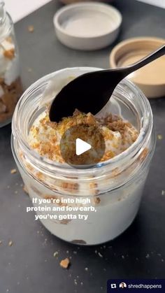 a glass jar filled with food on top of a table