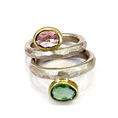 Pink and Green Tourmaline Ring Set, Stacking Gemstone Rings, Solid Gold and Silver Stacking Rings Beautiful set of pink and green Tourmaline gemstones, set in solid 18k gold on sterling silver hammers bands. This ring set has a great charm, wearing both rings with the stones opposite each other. One beautiful pastel rose color opposite a mint green - very unusual look, perfect for a sophisticated office look or an elegant night out. Details - * Sterling silver. * 18k solid gold. * Silver band - Oval Multicolor Tourmaline Rings, Multicolor Oval Tourmaline Rings, Fusion Style Green Rings With Accent Stones, Green Fusion Style Rings With Accent Stones, Modern Multi-stone Green Rings, Green Fusion Rings With Accent Stones, Modern Green Multi-stone Rings, Unique Pink Multi-stone Rings, Green Oval Fusion Rings