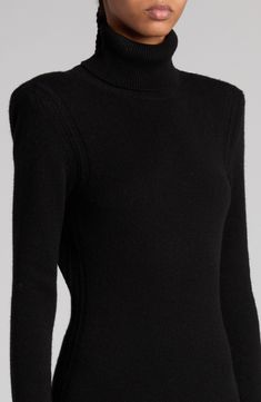 A triangular opening in back airs out this sweeping cashmere sweater-dress knit with long sleeves and pointelle-stitched trim. The floor-pooling trumpet hem completes this luxurious look. 61" length (size Medium) Slips on over head Turtleneck Long sleeves Unlined 100% cashmere Dry clean Made in Italy Designer Clothing Black Fitted Luxury Sweater, Luxury Black Fitted Sweater, Luxury Fitted Black Sweater, Designer Fitted Sweater For Formal Occasions, Fitted Cashmere Sweater Dress For Fall, Designer Fitted Cashmere Sweater, Fitted Cashmere Sweater For Formal Occasions, Classic Fitted Sweater Dress For Winter, Chic Fitted Cashmere Sweater Dress