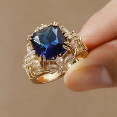 Beautiful Simulated Sapphire Gold Plated Ring.. Wow! Sizes Available: 7, 8 Blue Ring Jewelry For Party, Blue Sapphire Ring For Party, Blue Party Ring Jewelry, Blue Crystal Ring For Party, Blue Fine Jewelry Ring For Party, Blue Crystal Party Ring, Elegant Blue Crystal Ring Gift, Blue Open Crystal Ring, Fine Jewelry Blue Sapphire Ring For Party