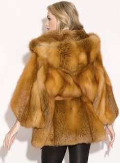 This luxurious fox fur cape maintains its naturally beautiful red color. It has a gorgeous hood, cropped sleeves, leather inserts and a detachable leather belt for a flattering fit. This item is one of a kind, one size fits most. This fur is custom-made, please allow approximately two weeks turnaround time. *This style is custom-made, please allow approximately 2-6 weeks for delivery. For questions or rush orders, please use our chat or call 334-277-7610. SKU: 2110-358052 Fur Origin: Finland Mad Luxury Hooded Fox Fur Coat, Luxury Fox Fur Coat With Faux Fur Trim, Luxury Fox Fur Mink Outerwear, Luxury Fox Fur Outerwear In Mink, Luxury Faux Fur Cape Coat, Cape With Hood, Fur Cape, Cropped Sleeves, Naturally Beautiful