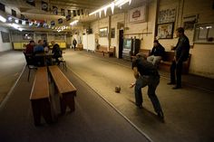 people are playing with a ball in an empty room