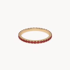 The Velvet Memory Ring is a manifestation of pure passion, captured in vibrant red rubies. Crafted from 14k gold, this ring is distinguished by its sparkling rubies in a brilliant cut, carefully set in a meticulously crafted setting. These rubies, shining in an intense red, symbolize passion and elegance. The Velvet Memory Ring is available in two versions: a more delicate option with 0.90ct. and a bolder version with 2.70ct. Both versions combine classic beauty with luxurious sparkle, making th Luxury Timeless Ruby Ring Gift, Red Ruby Halo Ring For Promise, Red Ruby Halo Promise Ring, Ruby Memory Ring, Red Stackable Birthstone Ring In Fine Jewelry Style, Stackable Ruby Ring In Fine Jewelry Style, Red Round Cut Halo Ring, Red Halo Diamond Ring For Promise, Red Ruby Birthstone Ring With Round Band