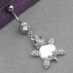 a sea turtle belly ring with crystal stones