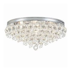 a chrome finish chandelier with clear crystal drops on the glass and metal frame