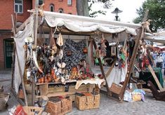 an outdoor market with lots of items on display