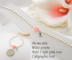 This listing is for 1 personalized Swarovski pearl and rose flower girl bracelet. This is a beautiful little bracelet that she will be able to wear long after the wedding! I offer discounts when you buy 3 or more of the same listing. Message me for prices and a custom listing. PLEASE TELL ME WHAT COLOR ROSE AND PEARLS AND WHAT STYLE OF FONT YOU WOULD LIKE IN THE NOTES TO SELLER SECTION WHEN YOU CHECK OUT. If you don't specify and I am unable to reach you, I will use a white rose, white pearls, a Personalized Rose Gold Charm Bracelet For Wedding, Pink Charm Bracelet For Wedding And Mother's Day, Personalized Pink Beaded Bracelets For Wedding, Personalized Pink Charm Bracelet For Wedding, Elegant Pink Name Bracelet For Birthday, Personalized Pink Bracelets For Wedding, Flower Girl Bracelets, Girl Bracelet, Light Pink Rose