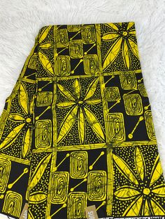 This yellow and Black African Fabric is high quality African print made from 100% cotton and it's 45 inches wide. It is used for making African Clothing, African quilts, & For Home decoration. FYI: Print is Double sided. The listing is for 1, 6 yards and Headwrap Each piece of fabric measures:  36in by 45in for 1 yard 216in by 45in for 6 yards 70in by 22in for Head wrap If you purchase more than one yard, you will receive one continuous piece. *If you require more than what I have listed, feel free to send me email. CARE INSTRUCTIONS: *DO NOT BLEACH *Hand wash with cold water and mild soap or Dry clean *Press with hot iron for a crispy look. Color may be different due to your monitor Printed Yellow Ankara Fabric, Yellow Printed Ankara Fabric, Yellow Traditional Cotton Fabric, Yellow Cotton Fabric With Traditional Patterns, Traditional Yellow Cotton Fabric, Yellow Ankara Fabric With Traditional Patterns, African Headwrap, African Quilts, Clean And Press