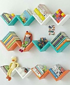 colorful bookshelves are arranged on the wall to display children's books and toys