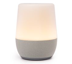 the google home speaker is lit up in front of a white background and grey base