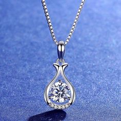 Solitaire: 1.00 carat VVS E/F  Gold: 14k 2.30 gm Small Diamonds: 0.10 carat VVS EF At SolitairesByMoha, you will get only the finest Lab Grown Diamonds that are well cut and are extra sparkly.  This solitaire is made by Chemical Vapour Deposition method. This Solitaire comes with IGI Certificate. Round Diamond Necklace With Elegant Design For Gift, Round Diamond Necklace With Elegant Design, Elegant Pendant Diamond Necklace For Gift, Elegant Round Pendant Drop Necklace For Anniversary, Elegant White Gold Drop Necklace Gift, Elegant White Gold Round Drop Necklace, Elegant White Gold Drop Necklace For Gift, Elegant Round Diamond Drop Necklace, Elegant Teardrop Pendant Necklace For Her