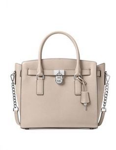 Classic details like chain-links and iconic charms brighten the sturdy frame of a well-organized MICHAEL Michael Kors satchel in rich leather.14-1/4"W x 10-1/2"H x 6"DInterior features 1 zip pocket, 5 slip pockets and key clip4-1/4"L double handles; 18-1/2" to 21-1/4"L adjustable strapZip closureExterior features gleaming hardwareLeather; lining: polyesterColor: Cement Woman Backpack, Michael Kors Satchel, Leather Satchel Handbags, Key Clip, Barbie Stuff, Leather Satchel Bag, 6 D, Cute Purses, Satchel Purse