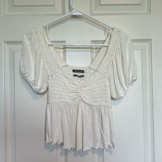 White Urban Outfitters Brand Top That Looks Like A Milkmaid Style With Little Poofy Sleeves. Never Worn! Very Cute, Just Not My Style. Looks Like It Would Do Well As An Under Layer For A Renaissance Fair Outfit Too! Urban Outfitters V-neck Summer Blouse, White Short Sleeve Blouse With Smocked Bodice, Fitted V-neck Peasant Top Casual, Cotton V-neck Top With Smocked Bodice, White V-neck Blouse With Smocked Bodice, White Blouse With Smocked Bodice And Short Sleeves, Fitted V-neck Peasant Top, White Fitted Top With Smocked Bodice, White Fitted Tops With Smocked Bodice