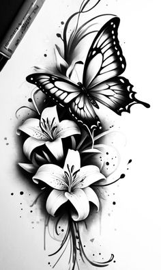 a black and white drawing of flowers with butterflies on it's wings, next to a marker pen