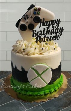 a birthday cake with a video game controller on top