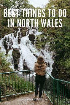 a woman standing in front of a waterfall with the words best things to do in north wales