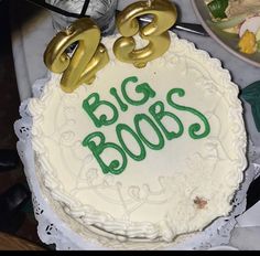 a birthday cake with the words big boos on it and two gold numbers sitting on top