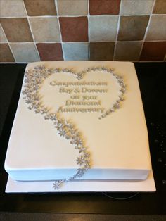 a heart shaped cake sitting on top of a counter