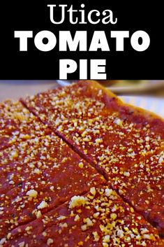 a close up of food on a plate with the words uticaa tomato pie