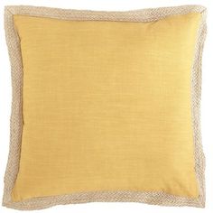 a yellow pillow on a white background